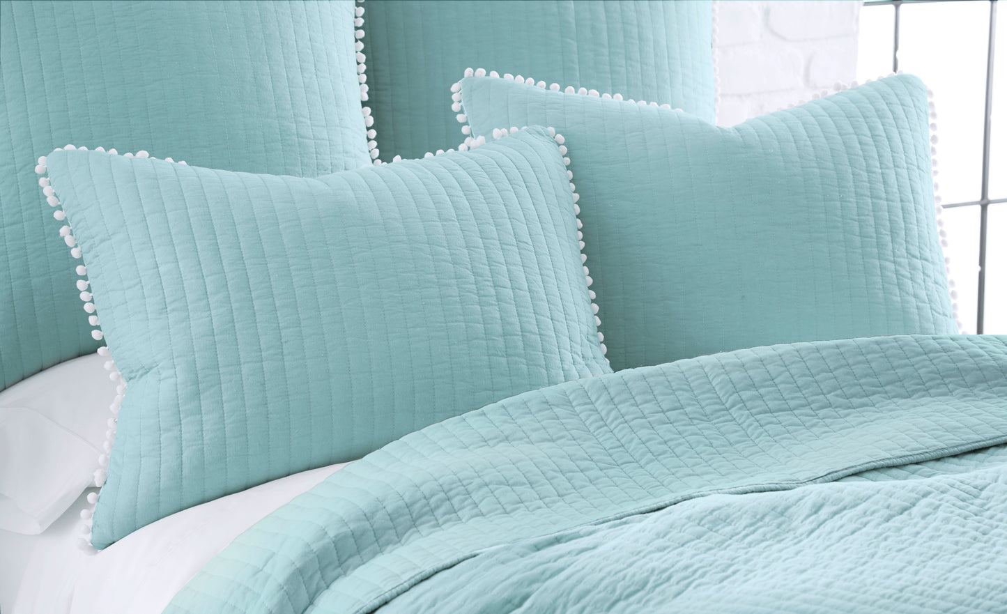 Clavo Pom Pom Coverlet Set.